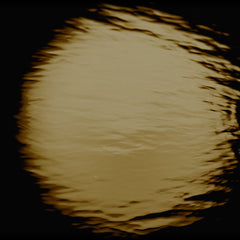 A full moon reflected in water.